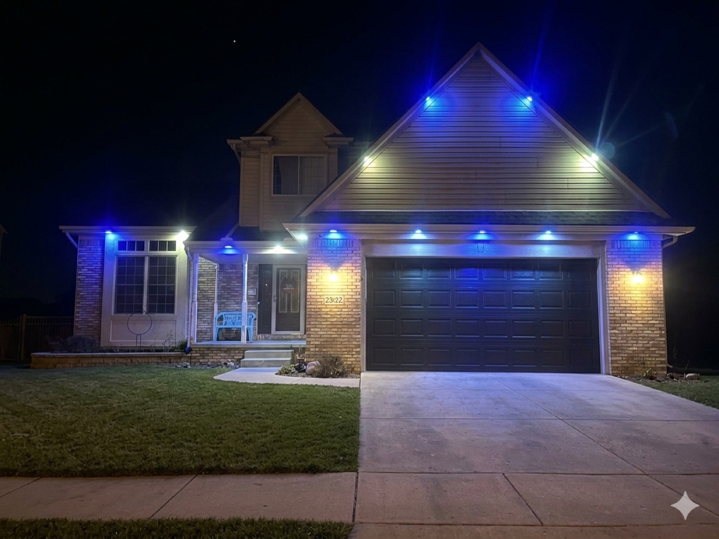 Home exterior with custom accent lighting by Downriver Wire Works